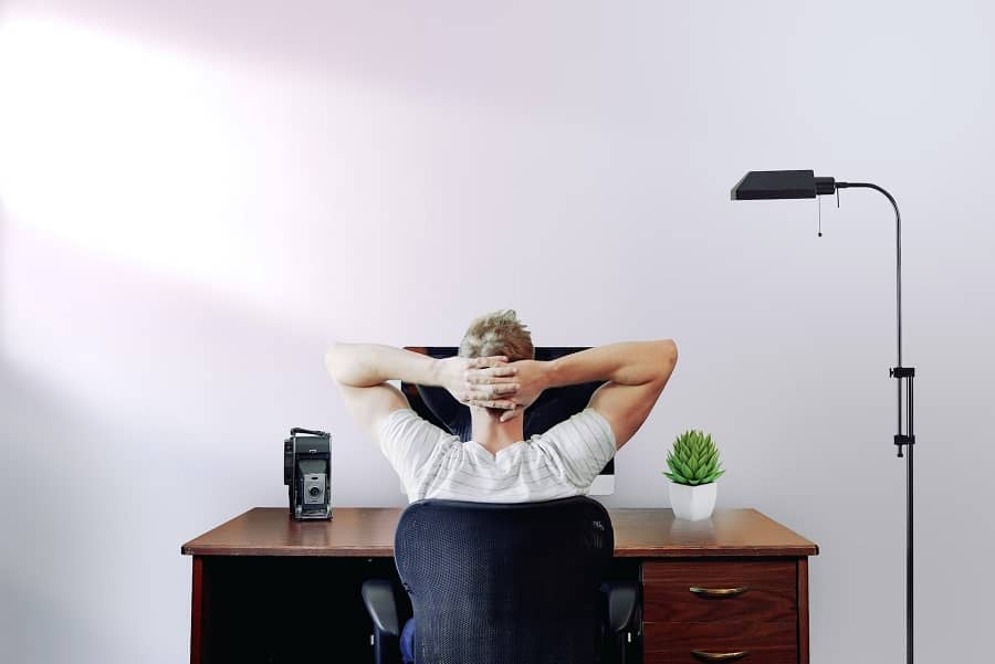 Best work from home jobs a man relaxing at a desk.