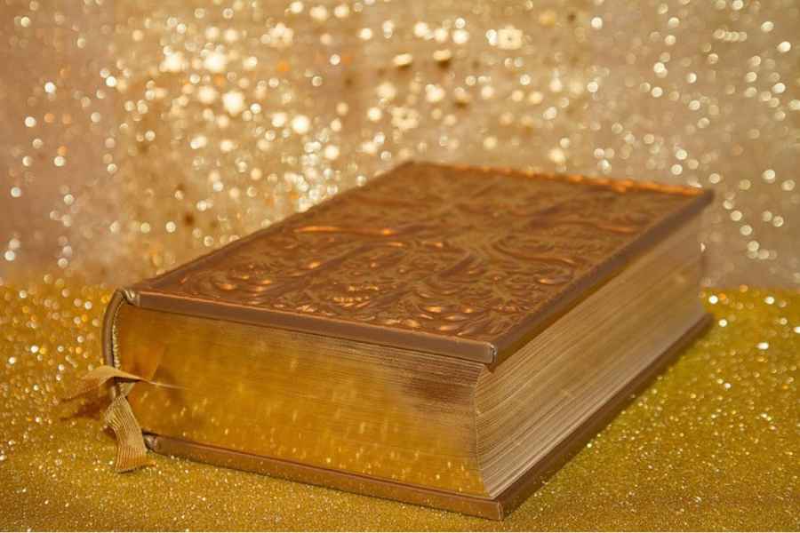 a golden book on a golden background