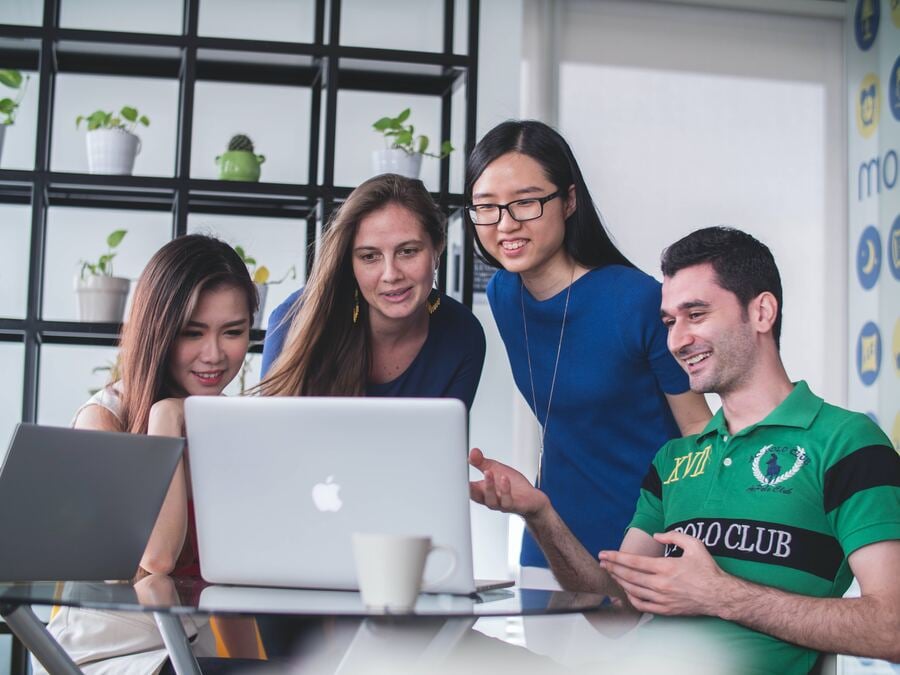 Image of a group of people appreciating an email ending